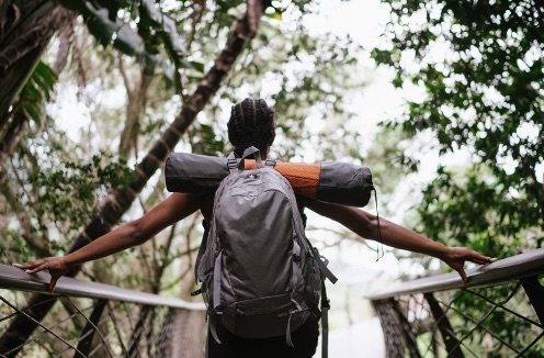 hiker on bridge